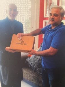 Mr. Sanjay Dang presenting a pair of UV Overseas shoes to Mr. Hamid Karzai, former President of Afghanistan